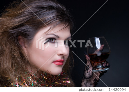 Closeup portrait of girl with red lips, tinsel and wineglass on Closeup portrait of girl with red lips, tinsel and wineglass on 14420094