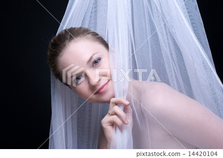 Closeup portrait of beautiful blond girl in white fabric Closeup portrait of beautiful blond girl in white fabric 14420104