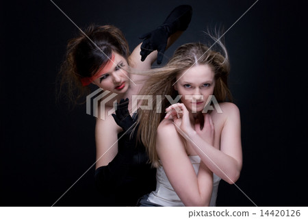 Closeup portrait of two girls: good & evil Closeup portrait of two girls: good & evil 14420126