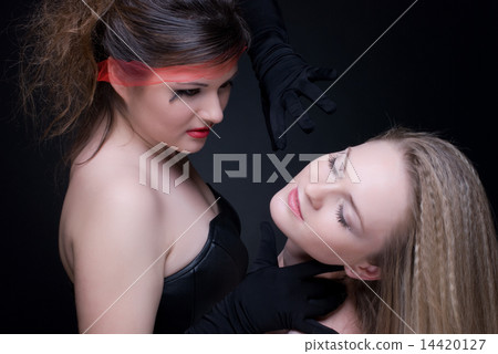 Closeup portrait of two girls: good & evil Closeup portrait of two girls: good & evil 14420127