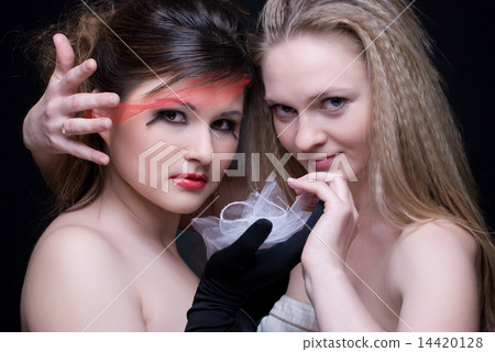 Closeup portrait of two girls: good & evil Closeup portrait of two girls: good & evil 14420128