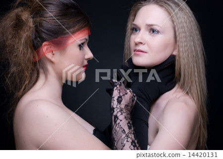 Closeup portrait of two girls: good & evil Closeup portrait of two girls: good & evil 14420131