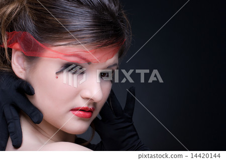 Close up portrait of girl with red lips on black 14420144