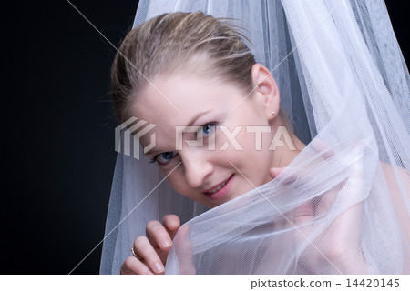 Closeup portrait of beautiful blond girl in white fabric 14420145