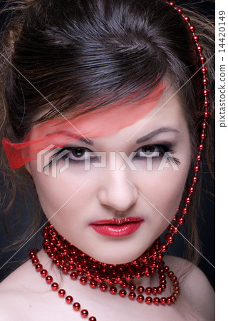 Close up portrait of girl with red lips and beads on black Close up portrait of girl with red lips and beads on black 14420149