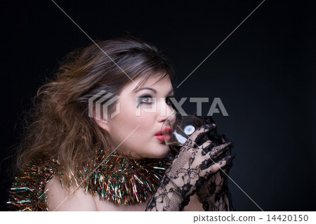 Closeup portrait of girl with red lips, tinsel and wineglass on Closeup portrait of girl with red lips, tinsel and wineglass on 14420150