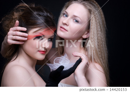 Closeup portrait of two girls: good & evil Closeup portrait of two girls: good & evil 14420153