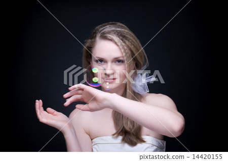Closeup portrait of blond girl with soap bubbles on black Closeup portrait of blond girl with soap bubbles on black 14420155
