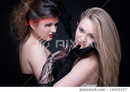 Closeup portrait of two girls: good & evil Closeup portrait of two girls: good & evil 14420157