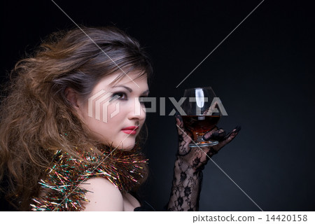 Closeup portrait of girl with red lips, tinsel and wineglass on Closeup portrait of girl with red lips, tinsel and wineglass on 14420158