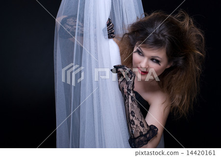 Closeup portrait of beautiful girl in white fabric on black Closeup portrait of beautiful girl in white fabric on black 14420161