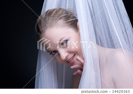 Closeup portrait of beautiful blond girl in white fabric Closeup portrait of beautiful blond girl in white fabric 14420163