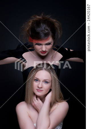 Closeup portrait of two girls: good & evil Closeup portrait of two girls: good & evil 14420167