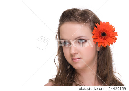 Close up portrait of young beautiful woman with orange flower Close up portrait of young beautiful woman with orange flower 14420169