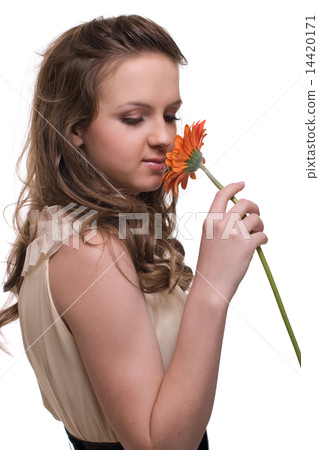 Close up portrait of young beautiful woman with orange flower 14420171