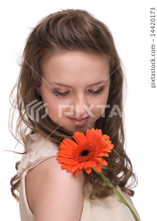 Close up portrait of young beautiful woman with orange flower 14420173