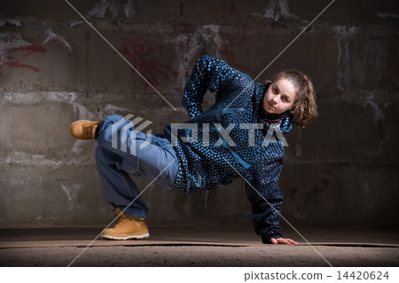 Hip hop dancer in modern style over brick wall Hip hop dancer in modern style over brick wall 14420624