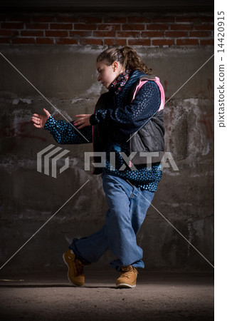 Hip hop dancer in modern style over brick wall 14420915
