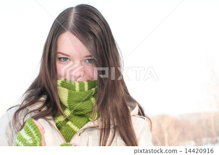Beautiful girl in green over winter landscape Beautiful girl in green over winter landscape 14420916