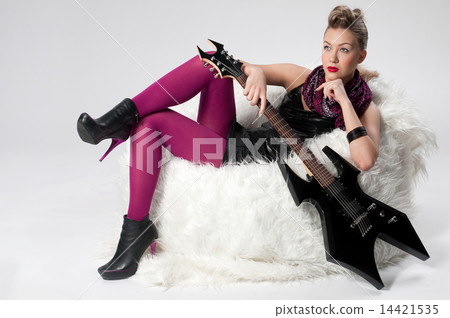 Beautiful young rock girl with black guitar Beautiful young rock girl with black guitar 14421535