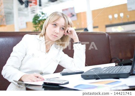 Young businesswoman with notebook in cafe Young businesswoman with notebook in cafe 14421741