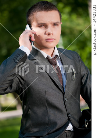 business man talk by mobile phone. Student 14423333