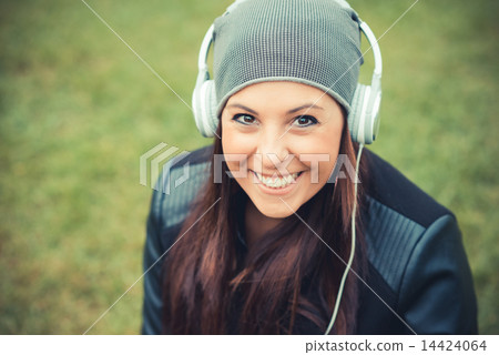 young beautiful brunette straight hair woman in the park 14424064