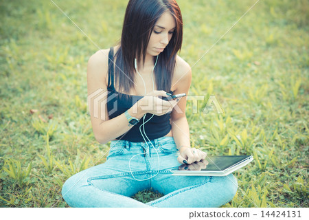 young beautiful brunette straight hair woman using tablet and sm 14424131
