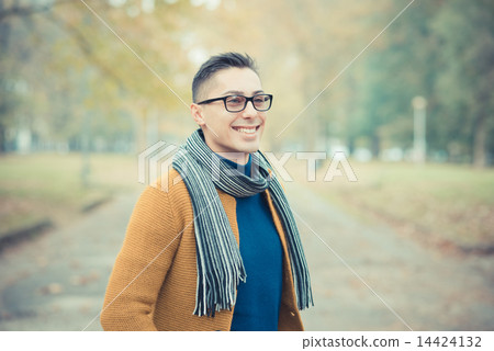 young handsome caucasian man in autumn park 14424132
