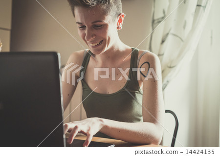 young lesbian stylish hair style woman using notebook young lesbian stylish hair style woman using notebook 14424135