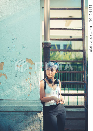 young beautiful short blue hair hipster woman with headphones mu young beautiful short blue hair hipster woman with headphones mu 14424151