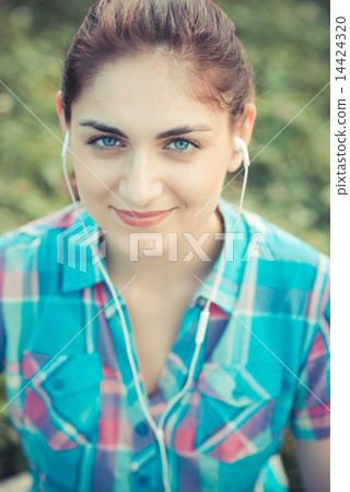 beautiful young hipster woman listening music 14424320