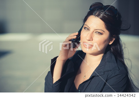 beautiful long black hair elegant business woman using smartphon 14424342