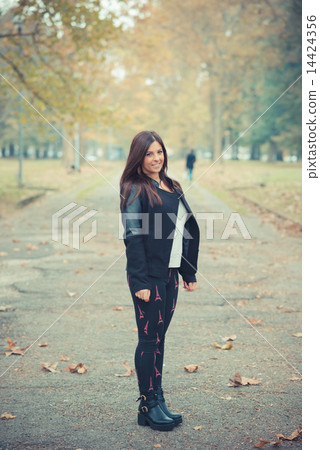 young beautiful brunette straight hair woman in the park 14424356