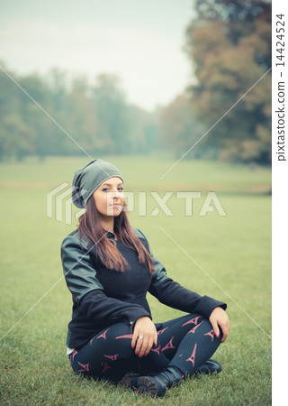 young beautiful brunette straight hair woman in the park 14424524