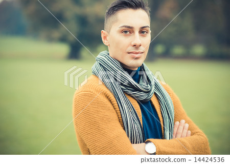 young handsome caucasian man in autumn park 14424536