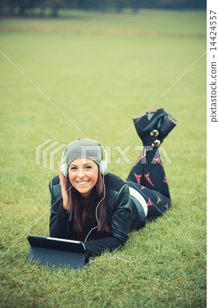 young beautiful brunette straight hair woman in the park 14424557