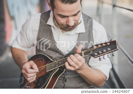 handsome big moustache hipster man playing mandolin handsome big moustache hipster man playing mandolin 14424807