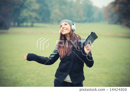 young beautiful brunette straight hair woman in the park young beautiful brunette straight hair woman in the park 14424808