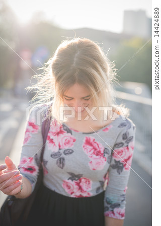 young beautiful blonde woman outdoor 14424889