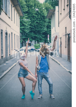 horse and rabbit mask couple of friends young man and woman 14424895