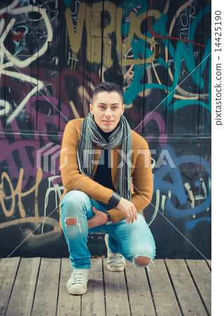 young handsome caucasian man in autumn park young handsome caucasian man in autumn park 14425190