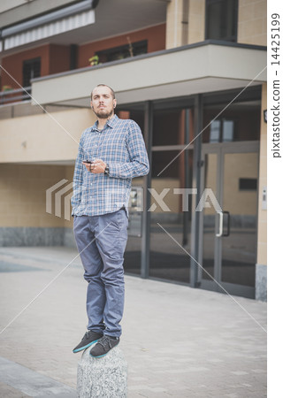 handsome hipster casual multitasking modern man listening music handsome hipster casual multitasking modern man listening music 14425199