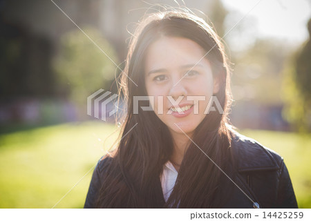 young beautiful long hair woman in town 14425259