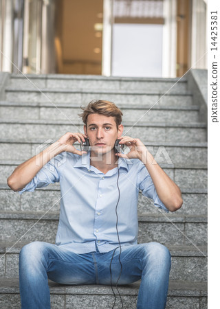 young model hansome blonde man with headphones 14425381