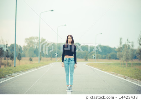 young beautiful brunette straight hair woman on the road 14425438