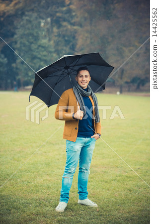 young handsome caucasian man in autumn park 14425562
