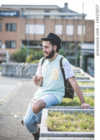 young handsome hipster gay modern man using smartphone 14425657