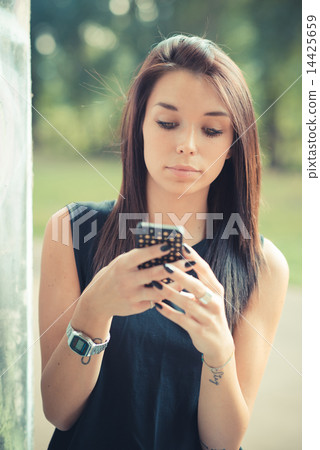 young beautiful brunette straight hair woman using smartphone 14425659