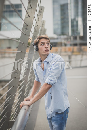 young model hansome blonde man with headphones 14425678